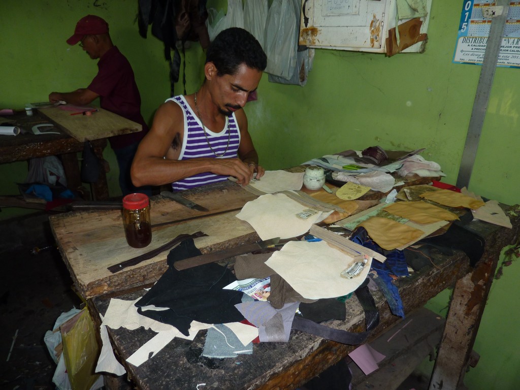 Leather smith making a leather bag in Granada Nicaragua